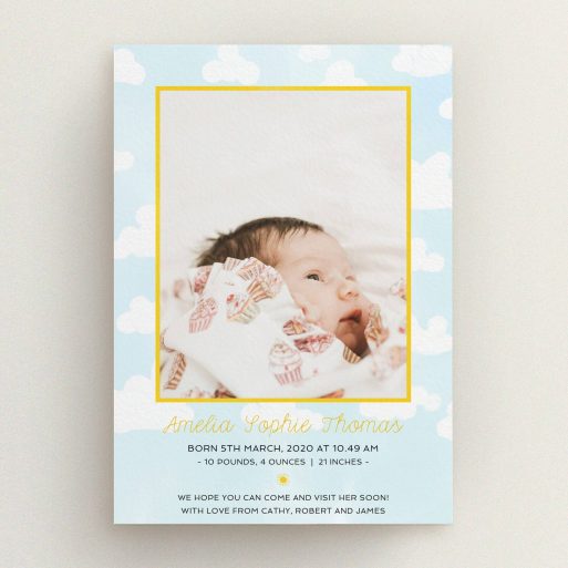A birth announcement card design titled "Blue Skies". It is an A5 card in a portrait orientation. It is a photographic birth announcement card with room for 1 photo. "Blue Skies" is available as a flat card, with tones of blue, yellow and white.