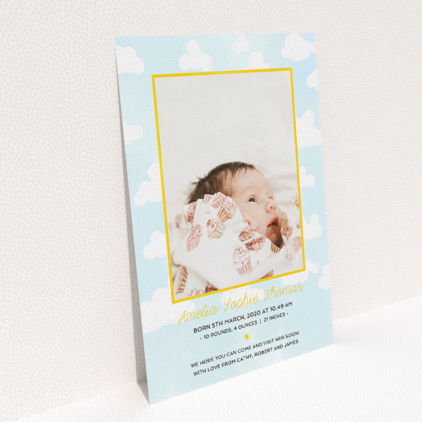 A birth announcement card design titled "Blue Skies". It is an A5 card in a portrait orientation. It is a photographic birth announcement card with room for 1 photo. "Blue Skies" is available as a flat card, with tones of blue, yellow and white.