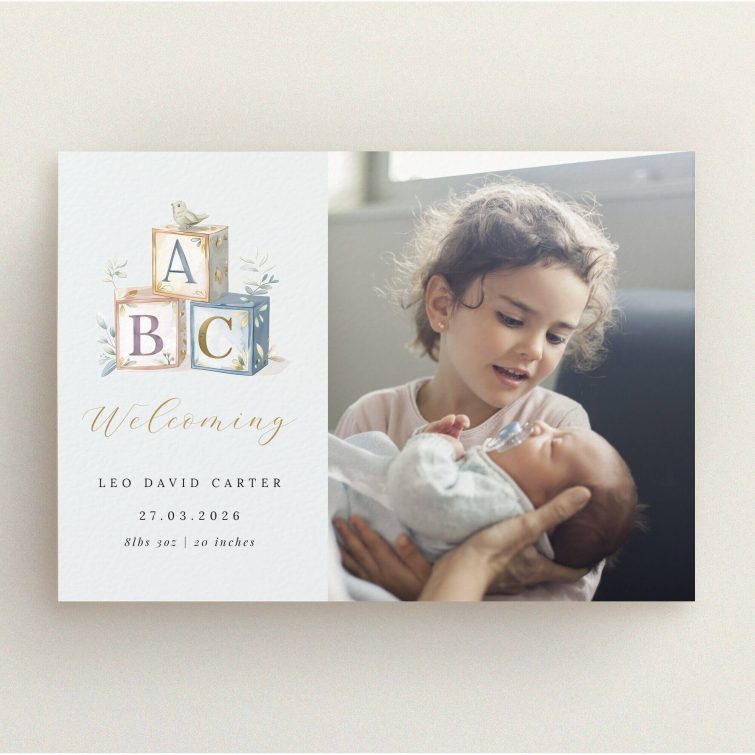 Birth announcement card design featuring two photos and baby ABC blocks illustration.