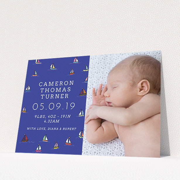 A birth announcement card called "Cowes Week". It is an A5 card in a landscape orientation. It is a photographic birth announcement card with room for 1 photo. "Cowes Week" is available as a flat card, with mainly blue colouring.