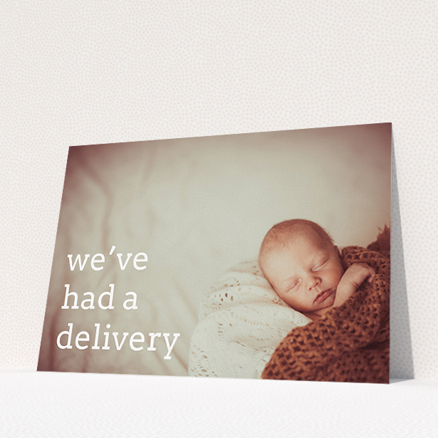 A birth announcement card named "Delivery". It is an A5 card in a landscape orientation. It is a photographic birth announcement card with room for 1 photo. "Delivery" is available as a flat card, with mainly white colouring.