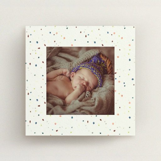 A birth announcement card design named "Dot-dot-dot". It is a square (148mm x 148mm) card in a square orientation. It is a photographic birth announcement card with room for 1 photo. "Dot-dot-dot" is available as a flat card, with tones of light cream and blue.