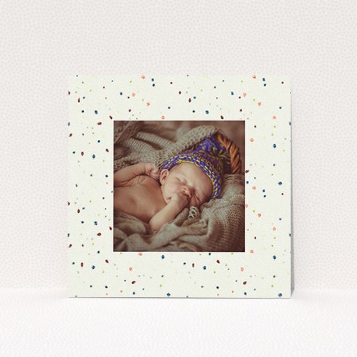 A birth announcement card design named "Dot-dot-dot". It is a square (148mm x 148mm) card in a square orientation. It is a photographic birth announcement card with room for 1 photo. "Dot-dot-dot" is available as a flat card, with tones of light cream and blue.
