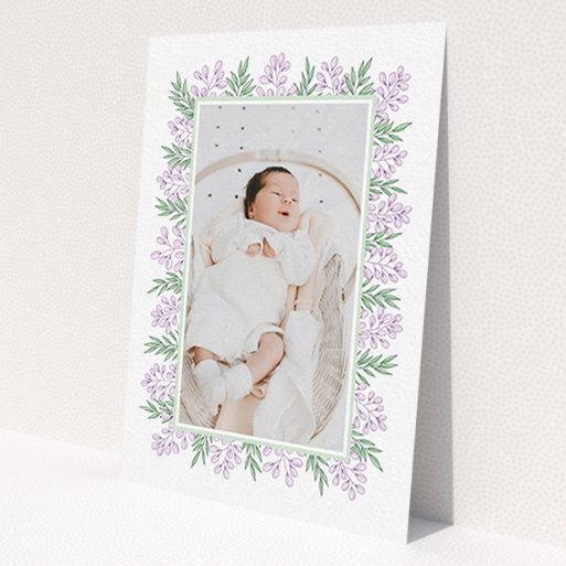 A birth announcement card called 'Floral Frame'. It is an A6 card in a portrait orientation. It is a photographic birth announcement card with room for 1 photo. 'Floral Frame' is available as a flat card, with tones of purple and green.