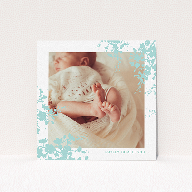 A birth announcement card design called "Forest Frame". It is a square (148mm x 148mm) card in a square orientation. It is a photographic birth announcement card with room for 1 photo. "Forest Frame" is available as a flat card, with tones of blue and white.