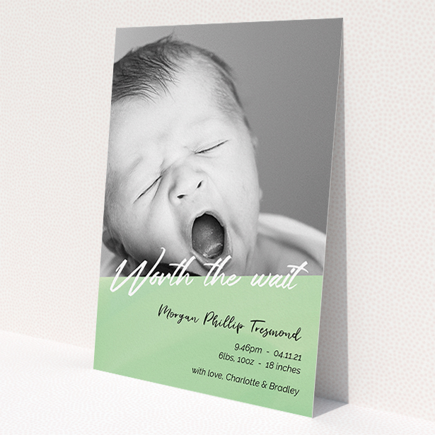 A birth announcement card design named 'Green Slant'. It is an A5 card in a portrait orientation. It is a photographic birth announcement card with room for 1 photo. 'Green Slant' is available as a flat card, with tones of green and white.