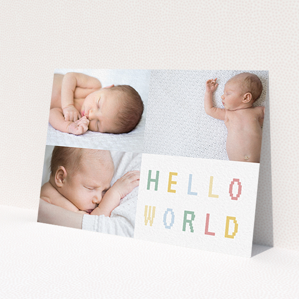 A birth announcement card named 'Hello World'. It is an A6 card in a landscape orientation. It is a photographic birth announcement card with room for 3 photos. 'Hello World' is available as a flat card, with tones of white and green.