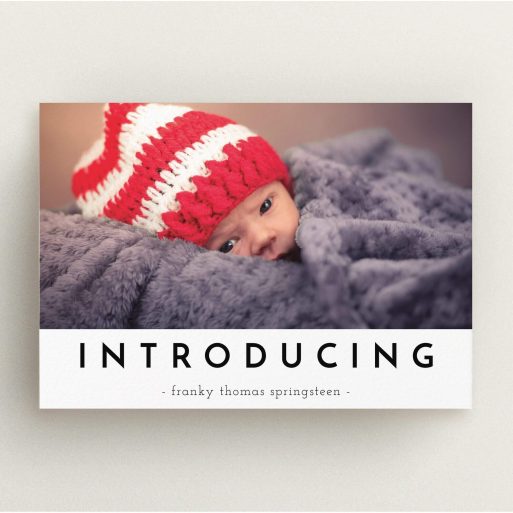 A birth announcement card template titled "Introducing". It is an A5 card in a landscape orientation. It is a photographic birth announcement card with room for 1 photo. "Introducing" is available as a flat card, with mainly white colouring.