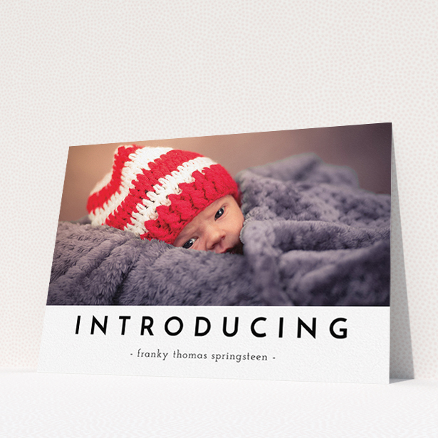 A birth announcement card template titled "Introducing". It is an A5 card in a landscape orientation. It is a photographic birth announcement card with room for 1 photo. "Introducing" is available as a flat card, with mainly white colouring.
