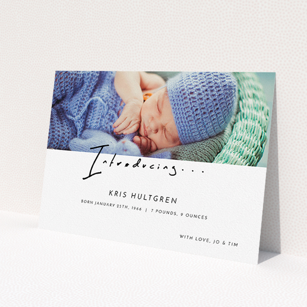 A birth announcement card design named 'Introducing this guy'. It is an A5 card in a landscape orientation. It is a photographic birth announcement card with room for 1 photo. 'Introducing this guy' is available as a flat card, with mainly white colouring.