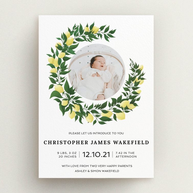 A birth announcement card design called "Lemon Wreath". It is an A5 card in a portrait orientation. It is a photographic birth announcement card with room for 1 photo. "Lemon Wreath" is available as a flat card, with tones of green and white.