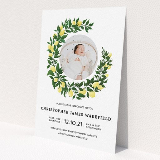 A birth announcement card design called 'Lemon Wreath'. It is an A5 card in a portrait orientation. It is a photographic birth announcement card with room for 1 photo. 'Lemon Wreath' is available as a flat card, with tones of green and white.