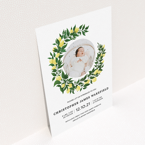 A birth announcement card design called "Lemon Wreath". It is an A5 card in a portrait orientation. It is a photographic birth announcement card with room for 1 photo. "Lemon Wreath" is available as a flat card, with tones of green and white.