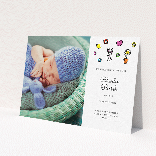 A birth announcement card called "Nursery Abstract". It is an A5 card in a landscape orientation. It is a photographic birth announcement card with room for 1 photo. "Nursery Abstract" is available as a flat card, with tones of white and blue.