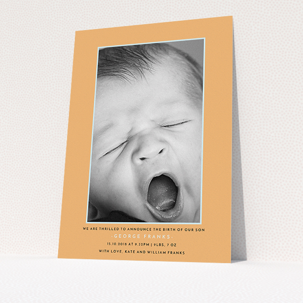 A birth announcement card design titled "Orange and Mint". It is an A5 card in a portrait orientation. It is a photographic birth announcement card with room for 1 photo. "Orange and Mint" is available as a flat card, with tones of orange and blue.
