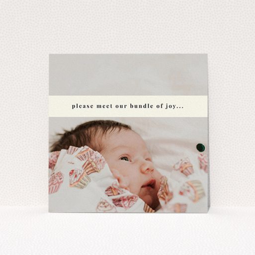 A birth announcement card design named "Our new bundle of joy". It is a square (148mm x 148mm) card in a square orientation. It is a photographic birth announcement card with room for 1 photo. "Our new bundle of joy" is available as a flat card, with mainly cream colouring.