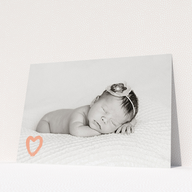 A birth announcement card design called "Pastel Heart". It is an A5 card in a landscape orientation. It is a photographic birth announcement card with room for 1 photo. "Pastel Heart" is available as a flat card, with mainly peach colouring.