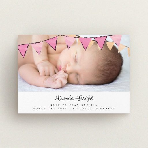 A birth announcement card design named "Pink Bunting". It is an A6 card in a landscape orientation. It is a photographic birth announcement card with room for 1 photo. "Pink Bunting" is available as a flat card, with tones of pink and white.