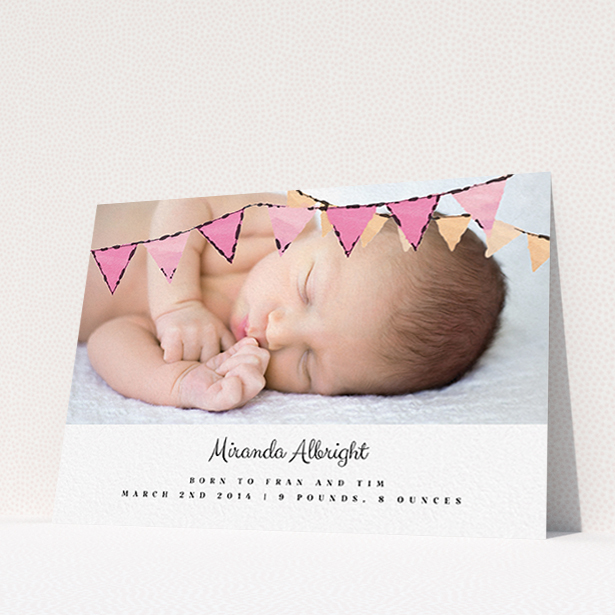 A birth announcement card design named "Pink Bunting". It is an A6 card in a landscape orientation. It is a photographic birth announcement card with room for 1 photo. "Pink Bunting" is available as a flat card, with tones of pink and white.