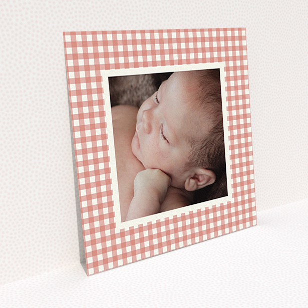 A birth announcement card design titled "Pink Plaid". It is a square (148mm x 148mm) card in a square orientation. It is a photographic birth announcement card with room for 1 photo. "Pink Plaid" is available as a flat card, with tones of pink and white.