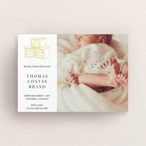 A birth announcement card called "Playtime". It is an A6 card in a landscape orientation. It is a photographic birth announcement card with room for 1 photo. "Playtime" is available as a flat card, with tones of white and yellow.