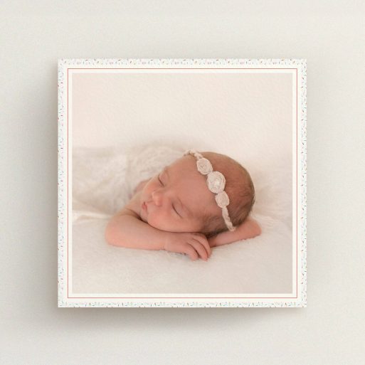 A birth announcement card design titled "Sprinkle Frame". It is a square (148mm x 148mm) card in a square orientation. It is a photographic birth announcement card with room for 1 photo. "Sprinkle Frame" is available as a flat card, with tones of cream, red and blue.