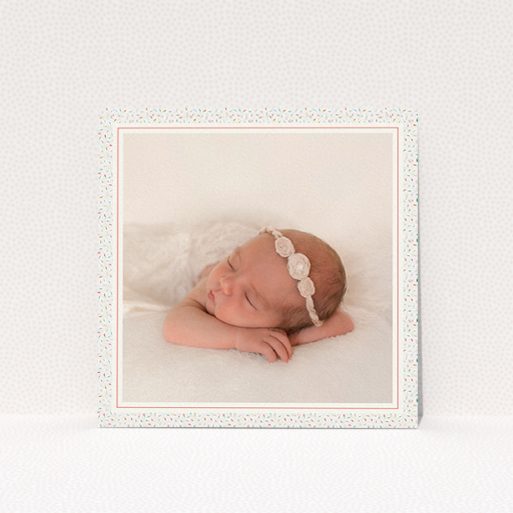A birth announcement card design titled "Sprinkle Frame". It is a square (148mm x 148mm) card in a square orientation. It is a photographic birth announcement card with room for 1 photo. "Sprinkle Frame" is available as a flat card, with tones of cream, red and blue.