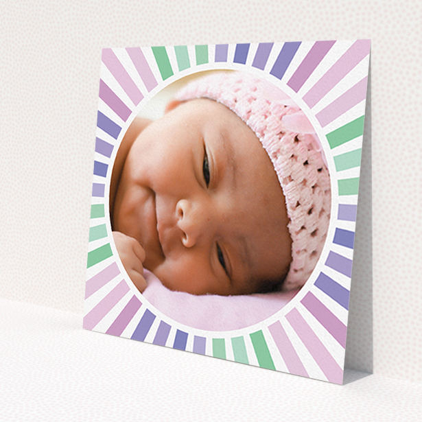 A birth announcement card design called 'Sun Centre'. It is a square (148mm x 148mm) card in a square orientation. It is a photographic birth announcement card with room for 1 photo. 'Sun Centre' is available as a flat card, with mainly light pink colouring.