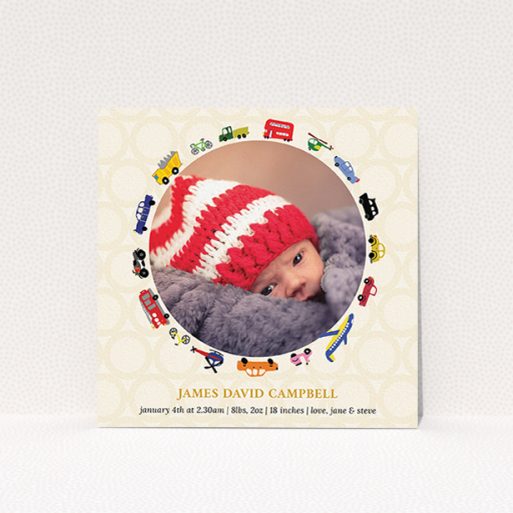 A birth announcement card called "Toy Transport". It is a square (148mm x 148mm) card in a square orientation. It is a photographic birth announcement card with room for 1 photo. "Toy Transport" is available as a flat card, with tones of cream, red and yellow.