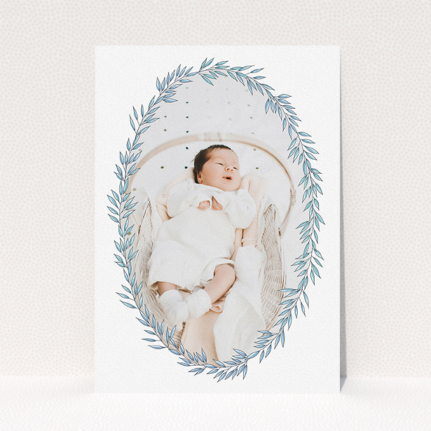 A birth announcement card called "Tussled Wreath". It is an A5 card in a portrait orientation. It is a photographic birth announcement card with room for 1 photo. "Tussled Wreath" is available as a flat card, with tones of blue and white.