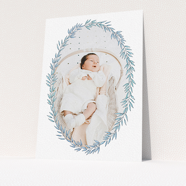 A birth announcement card design called "Tussled Wreath". It is an A6 card in a portrait orientation. It is a photographic birth announcement card with room for 1 photo. "Tussled Wreath" is available as a flat card, with tones of blue and white.