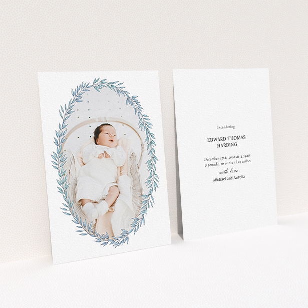 A birth announcement card design called "Tussled Wreath". It is an A6 card in a portrait orientation. It is a photographic birth announcement card with room for 1 photo. "Tussled Wreath" is available as a flat card, with tones of blue and white.