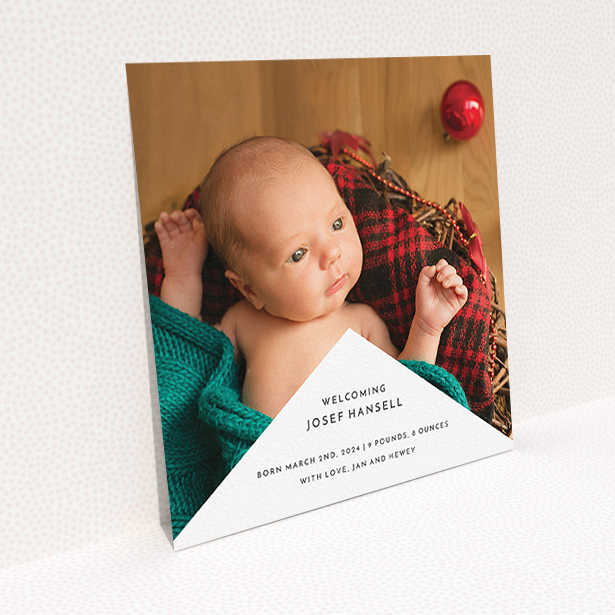 A birth announcement card called "Wedge Frame". It is a square (148mm x 148mm) card in a square orientation. It is a photographic birth announcement card with room for 1 photo. "Wedge Frame" is available as a flat card, with mainly white colouring.