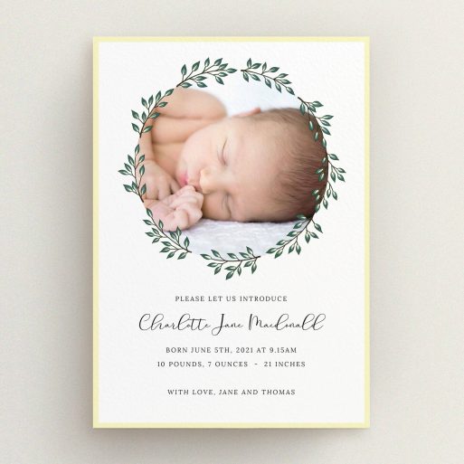 A birth announcement card named "Wreath Window". It is an A5 card in a portrait orientation. It is a photographic birth announcement card with room for 1 photo. "Wreath Window" is available as a flat card, with tones of green and yellow.