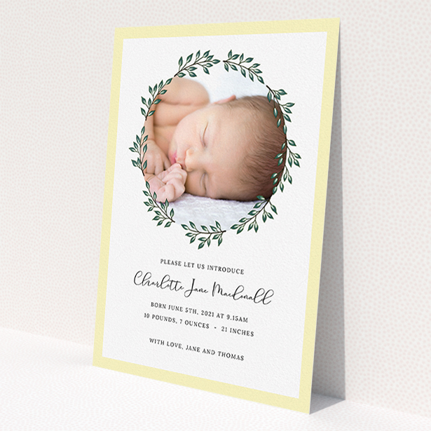 A birth announcement card named "Wreath Window". It is an A5 card in a portrait orientation. It is a photographic birth announcement card with room for 1 photo. "Wreath Window" is available as a flat card, with tones of green and yellow.