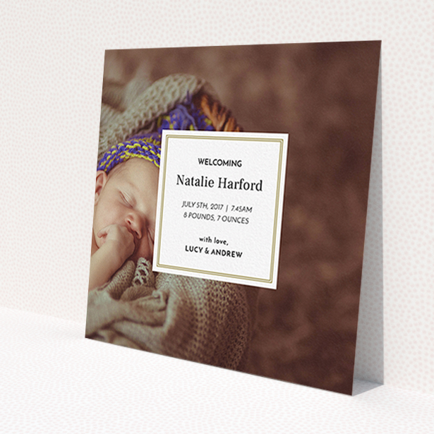 A birth announcement card design named 'Your Central Message'. It is a square (148mm x 148mm) card in a square orientation. It is a photographic birth announcement card with room for 1 photo. 'Your Central Message' is available as a flat card, with mainly gold colouring.