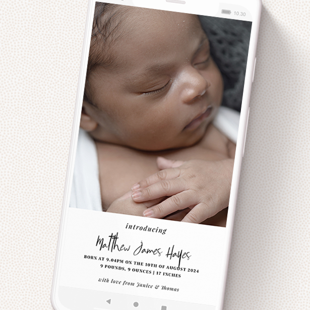 A birth announcement for whatsapp design titled 'A bit at the bottom'. It is a smartphone screen sized announcement in a portrait orientation. It is a photographic birth announcement for whatsapp with room for 1 photo. 'A bit at the bottom' is available as a flat announcement, with tones of black and white.