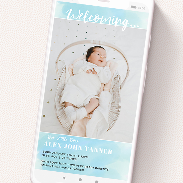 A birth announcement for whatsapp design named 'Watercolour Welcome Blue'. It is a smartphone screen sized announcement in a portrait orientation. It is a photographic birth announcement for whatsapp with room for 1 photo. 'Watercolour Welcome Blue' is available as a flat announcement, with tones of blue and white.