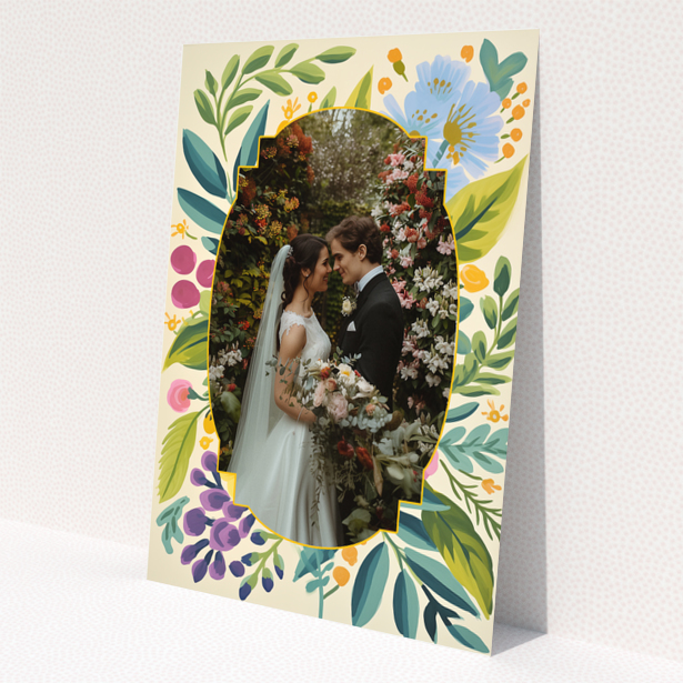 Wedding invitations design with floral border and a photo of a couple