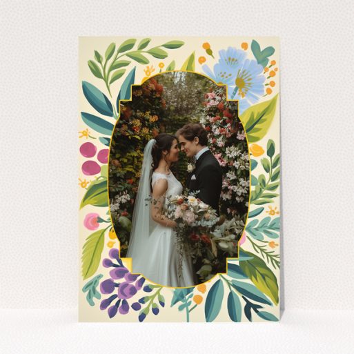 Wedding invitations design with floral border and a photo of a couple