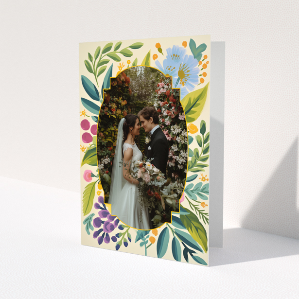 Wedding invitations design with floral border and a photo of a couple