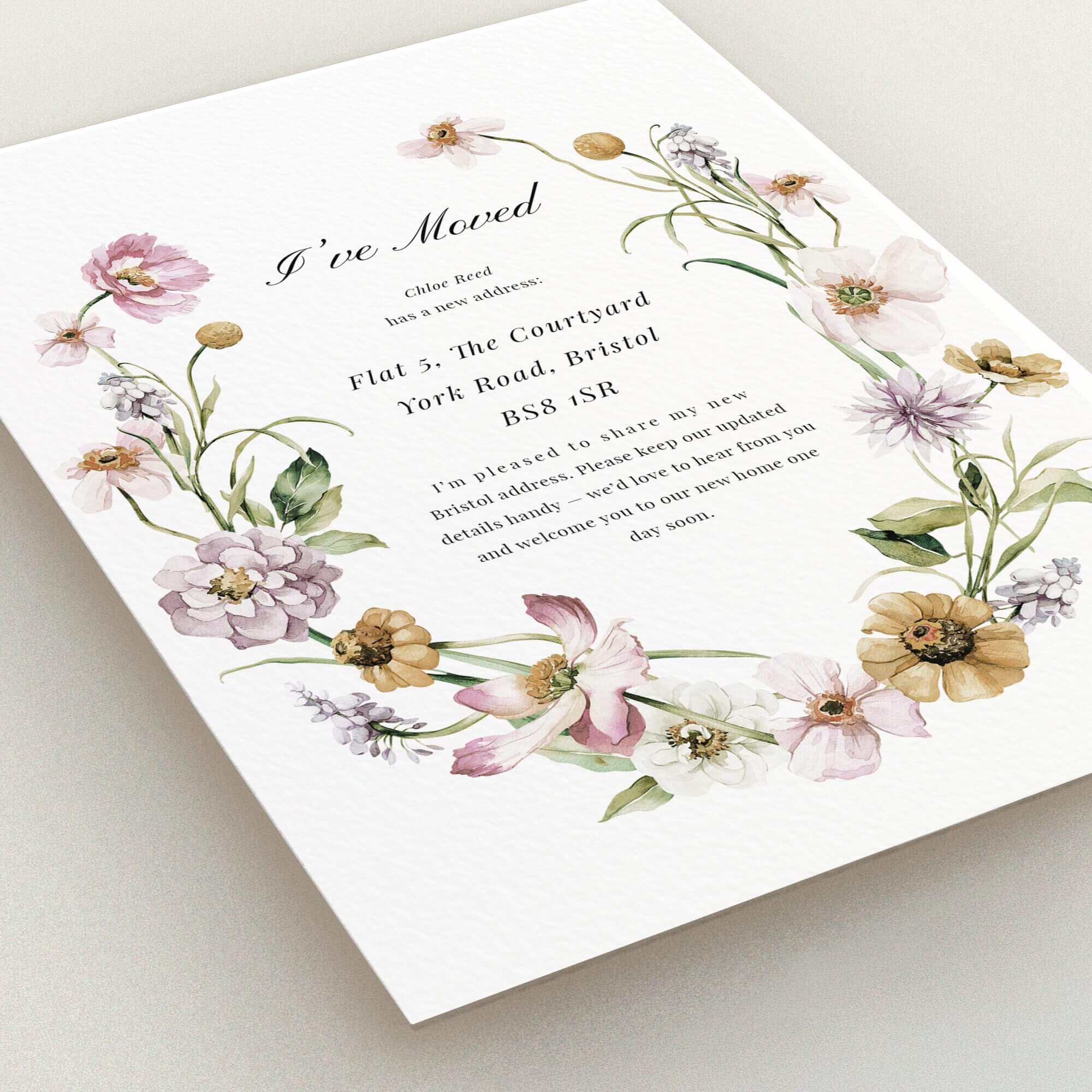 Floral change of address card design with two flower illustrations, perfect for announcing a new home in the UK.
