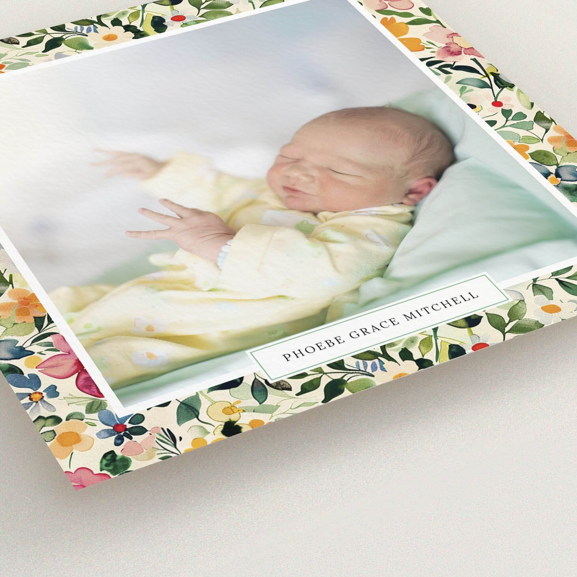 Floral border birth announcement card with one photo of a newborn baby.