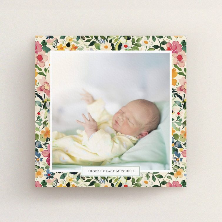 Floral border birth announcement card with one photo of a newborn baby.