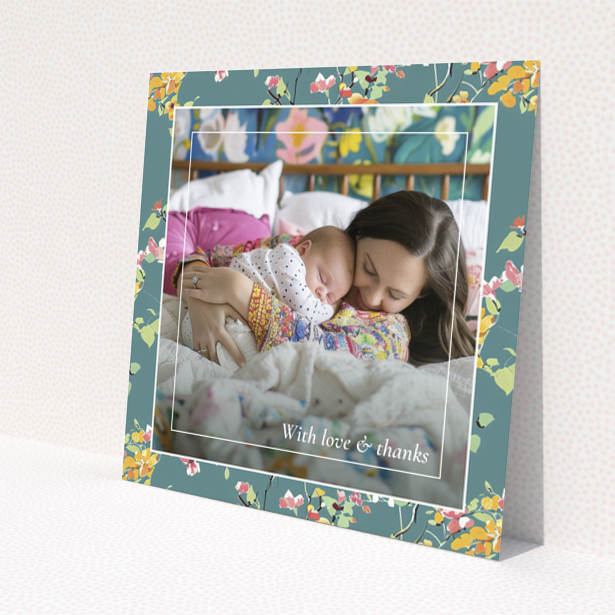 Floral baby thank you card with one photo of a mother and sleeping baby.