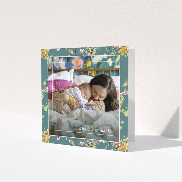 Floral baby thank you card with one photo of a mother and sleeping baby.