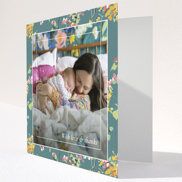 Floral baby thank you card with one photo of a mother and sleeping baby.