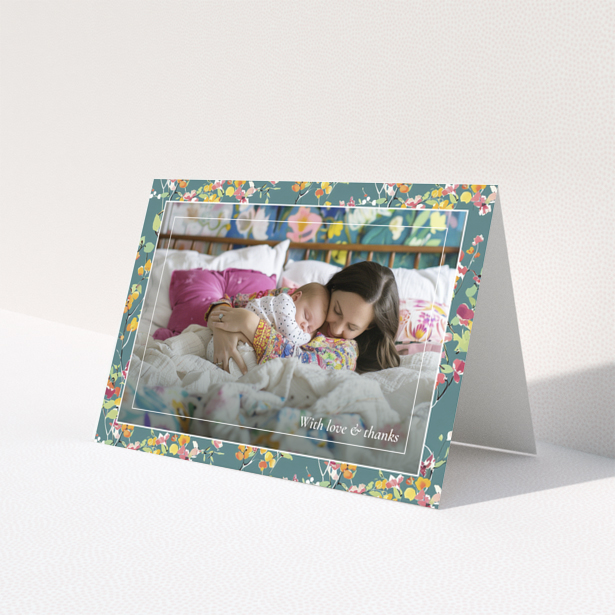 Floral baby thank you card with one photo of a mother and sleeping baby.