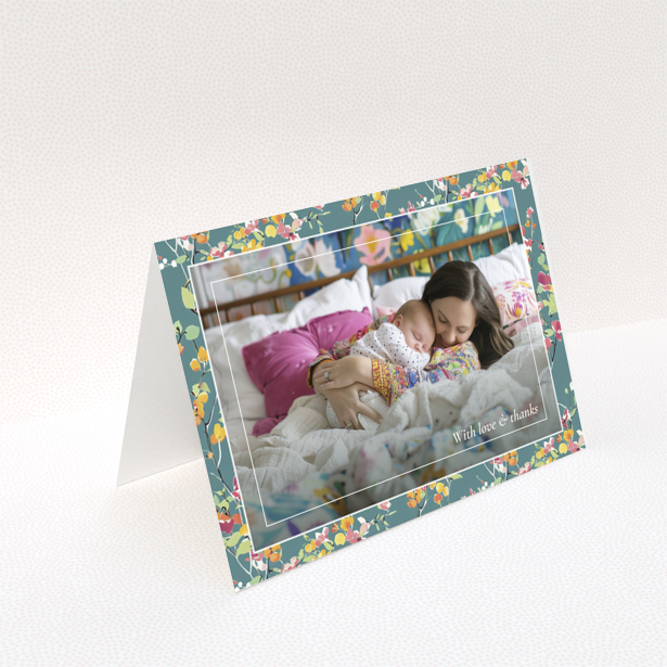Floral baby thank you card with one photo of a mother and sleeping baby.