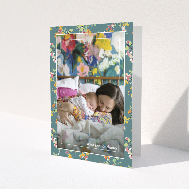 Floral baby thank you card with one photo of a mother and sleeping baby.